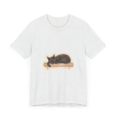 A close-up watercolor image of a black cat sleeping on a t-shirt