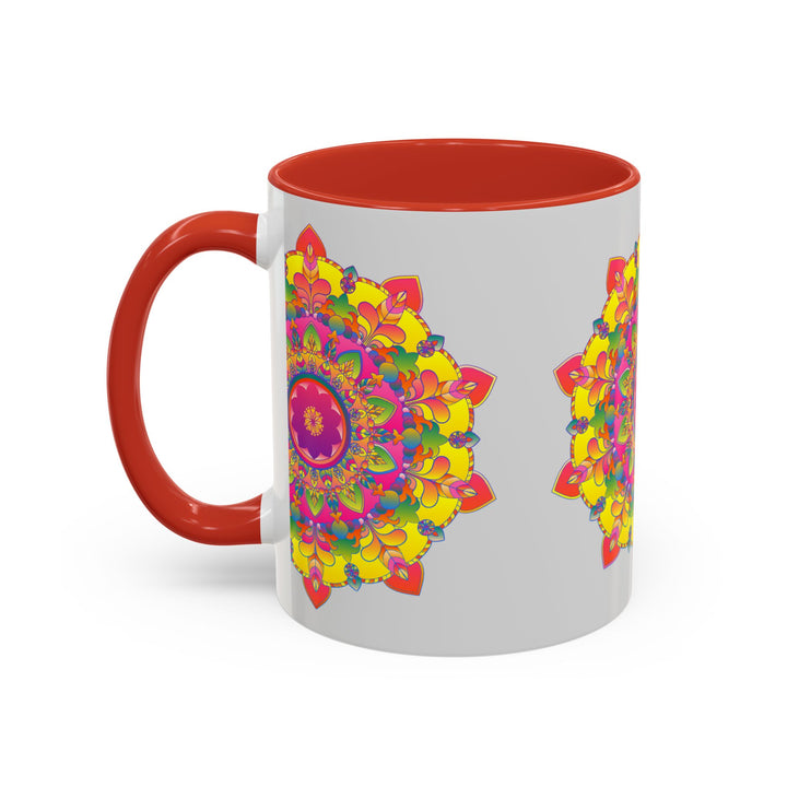 Vibrant mandala design in red, blue, and yellow on a grey ceramic mug