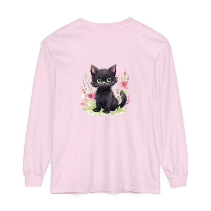 A colorful watercolor illustration of a playful kitten surrounded by vibrant floral patterns on a T-shirt