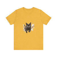 A close-up image of a black cat watercolor print t-shirt, featuring vibrant and detailed artwork of a cat in various shades of black, gray, and white with colorful splashes of watercolor paint