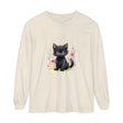 A cute and playful kitten surrounded by colorful floral watercolor design on a T-shirt