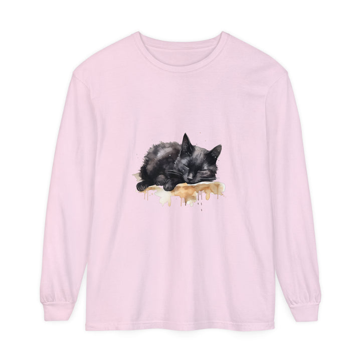 A watercolor illustration of a cute black cat sleeping on a T-shirt