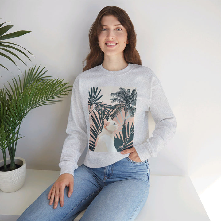 A cozy unisex sweatshirt featuring a cute cat under palm trees