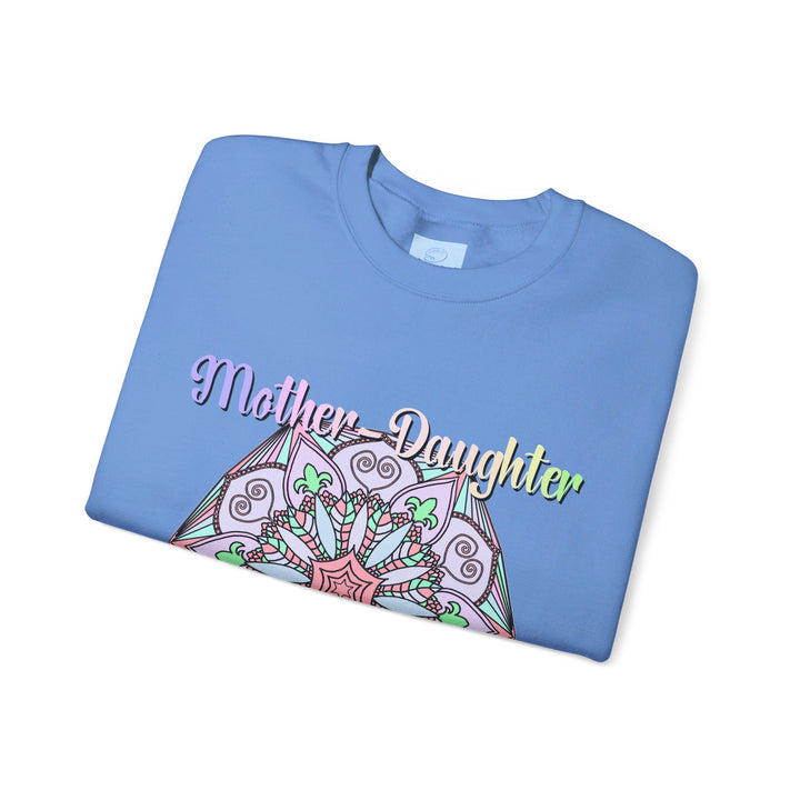 Mother and daughter hugging and smiling while wearing matching Mother-Daughter Bond Unisex Heavy Blend™ Crewneck Sweatshirts, perfect birthday gift for Mom