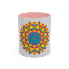 A beautiful handcrafted ceramic mug featuring a vibrant and intricate floral mandala design in a variety of bright and bold colors
