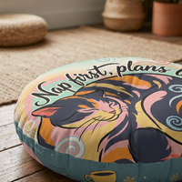 Winter cozy kitten in Ukiyo-e rhythm cat floor pillow, round and tufted, teal and pink tones, close-up lifestyle shot showing a plush, comfortable cushion in a cozy corner