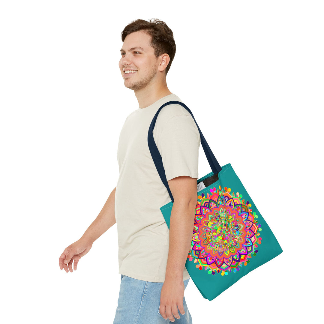 A beautiful aquamarine tote bag featuring a colorful mandala art design