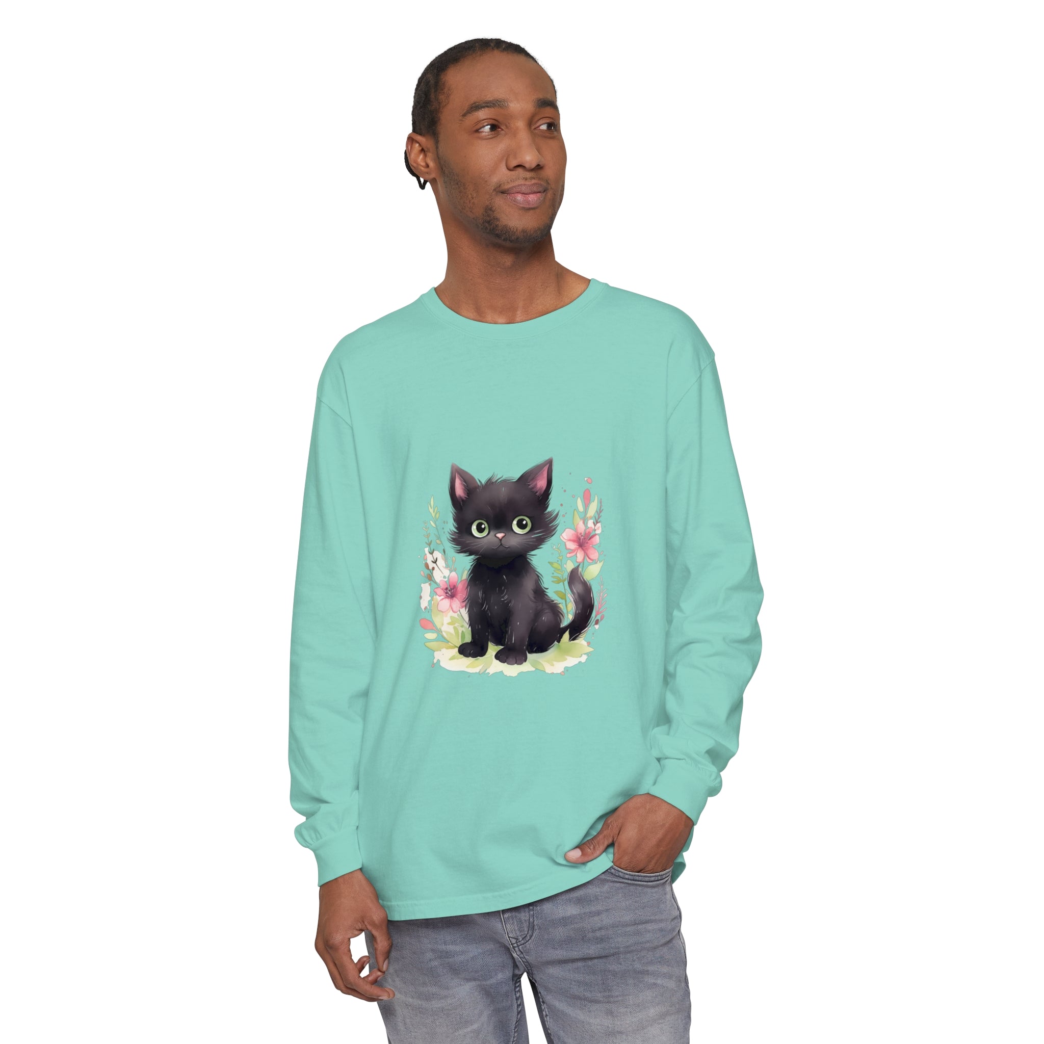 A playful kitten surrounded by vibrant floral watercolor on a t-shirt