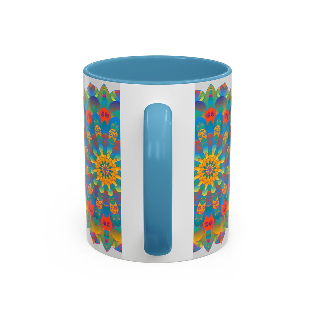 A beautiful handcrafted ceramic mug featuring a vibrant mandala design in yellow, orange, and blue colors