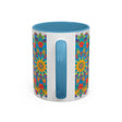 A beautiful handcrafted ceramic mug featuring a vibrant mandala design in yellow, orange, and blue colors