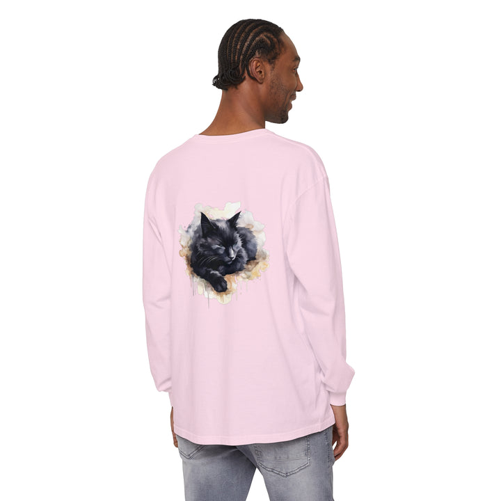 A detailed watercolor illustration of a black cat sleeping on a t-shirt