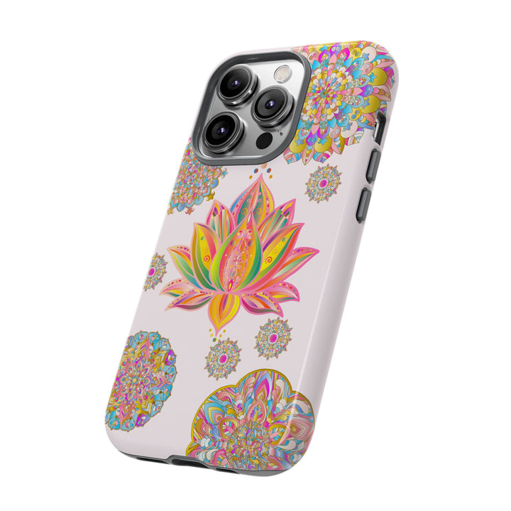 A light pink phone case with a mandala design featuring a lotus flower pattern