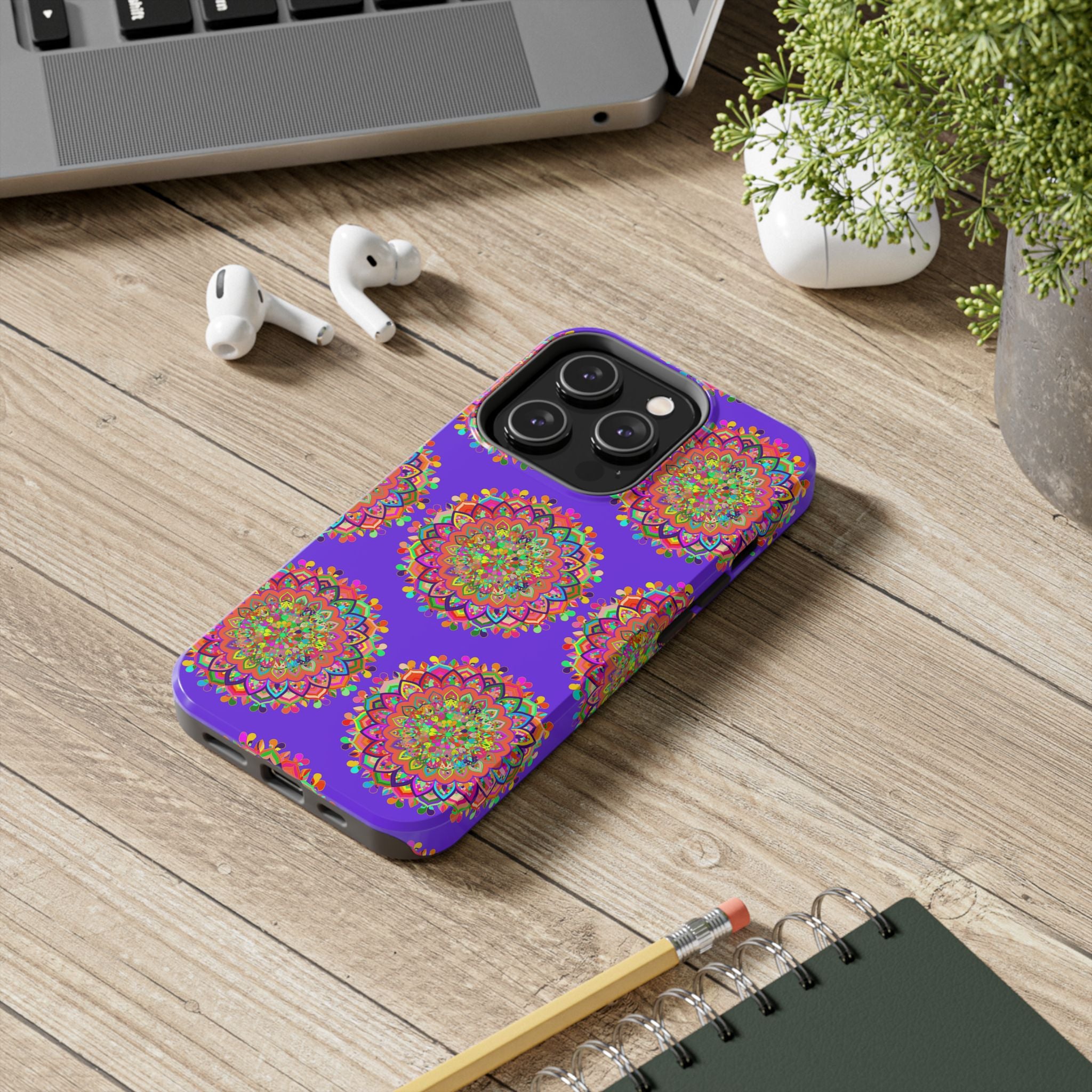 A close-up image of a hand drawn small purple mandala art phone case designed for iPhone X and XS, featuring intricate and detailed patterns