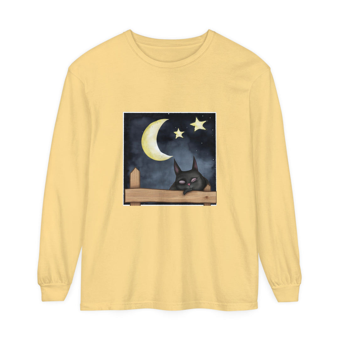 A black t-shirt with a cute sleeping cat against a starry night sky background