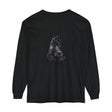 A close-up image of a black long sleeve t-shirt with a mystical black cat design on the front