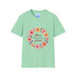 A beautiful white t-shirt with a colorful floral mandala design and a quote in the center