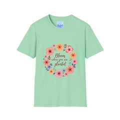 A beautiful white t-shirt with a colorful floral mandala design and a quote in the center