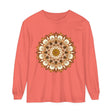 A close-up image of an intricate mandala design on a unisex long sleeve t-shirt