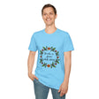 A close up image of a white t-shirt with a floral garland design, featuring the text Breathe in Peace Exhale Stress in a cursive font