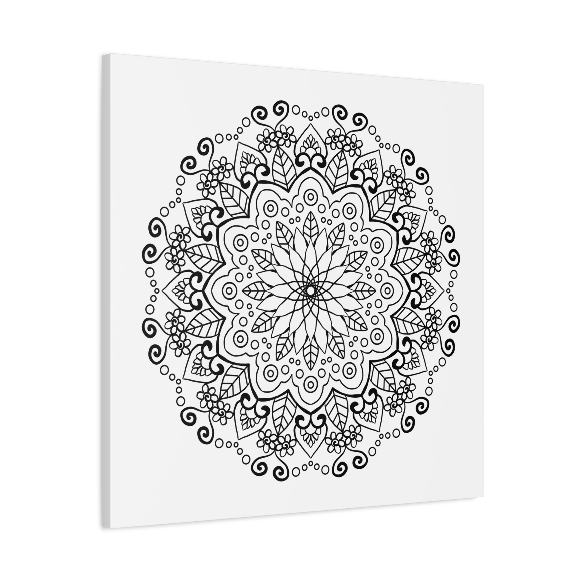 Handmade mandala art featuring intricate black and white designs, printed on matte canvas, stretched and framed at 125 inches