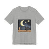 A black t-shirt featuring a sleepy cat under the moonlit night