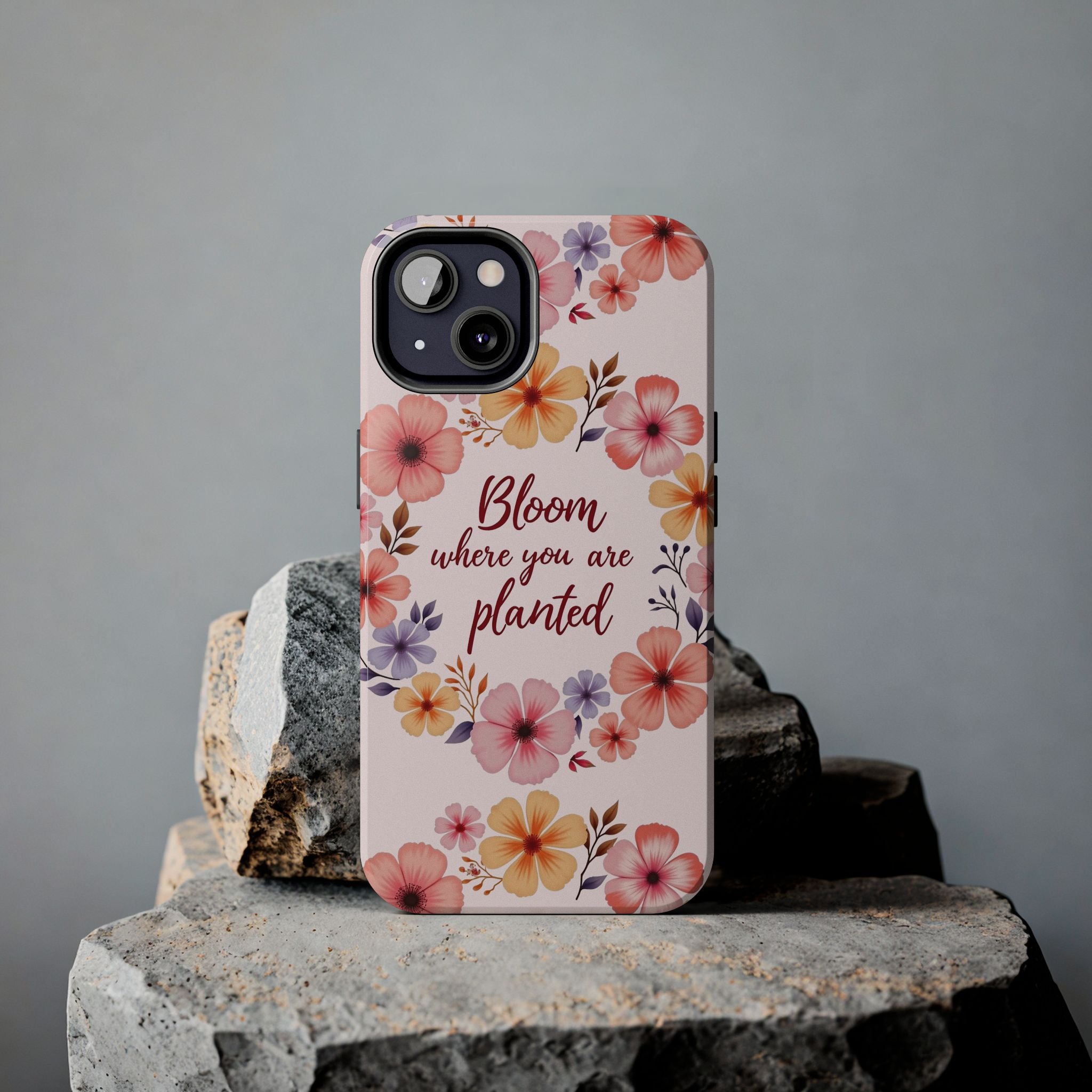 A light pink phone case with a delicate flower garland design, perfect to showcase your personality and style