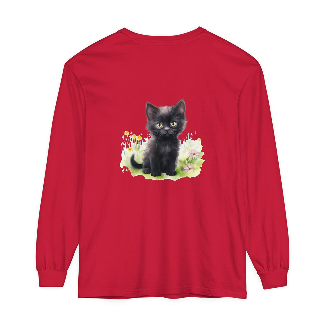 A cute black kitten playing in a colorful flower garden printed on a long sleeve t-shirt