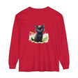 A cute black kitten playing in a colorful flower garden printed on a long sleeve t-shirt