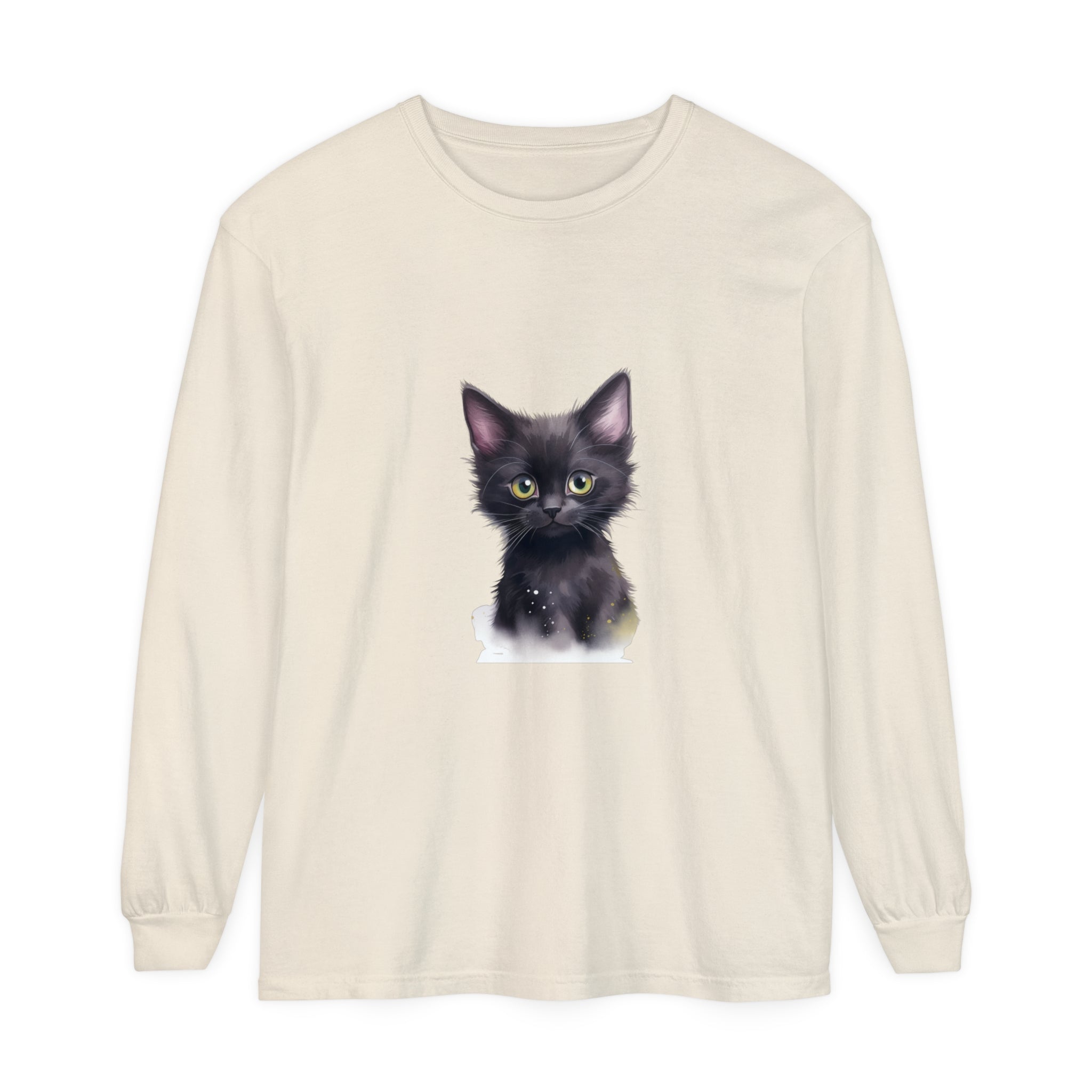 Adorable black kitten with bright green eyes sitting on a t-shirt