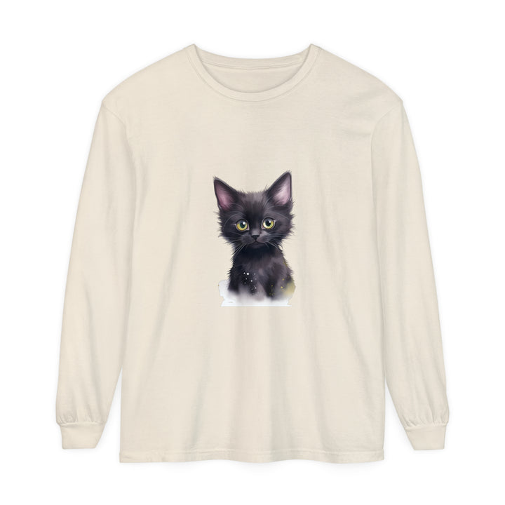 Adorable black kitten with bright green eyes sitting on a t-shirt