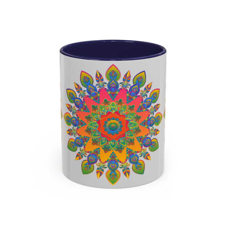 A beautiful and intricate mandala design in various colors adorns a grey coffee mug