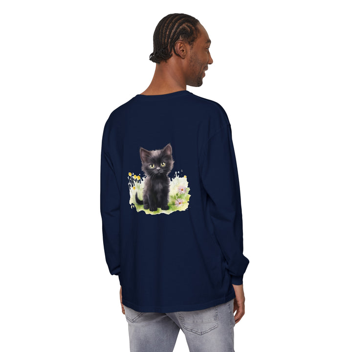 Adorable black kitten lounging in a colorful flower garden on a long sleeve t-shirt