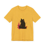 A close-up image of a Black Cat Mystery T-Shirt featuring colorful splatter art design in black, purple, and teal, creating a vibrant and eye-catching effect