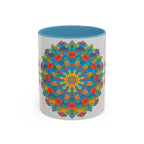 Handcrafted ceramic mug featuring vibrant mandala art in yellow, orange, and blue colors