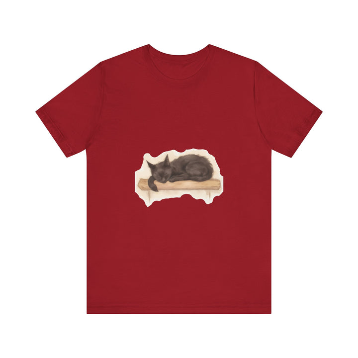 An adorable black cat curled up sleeping peacefully, depicted in watercolor on a soft t-shirt