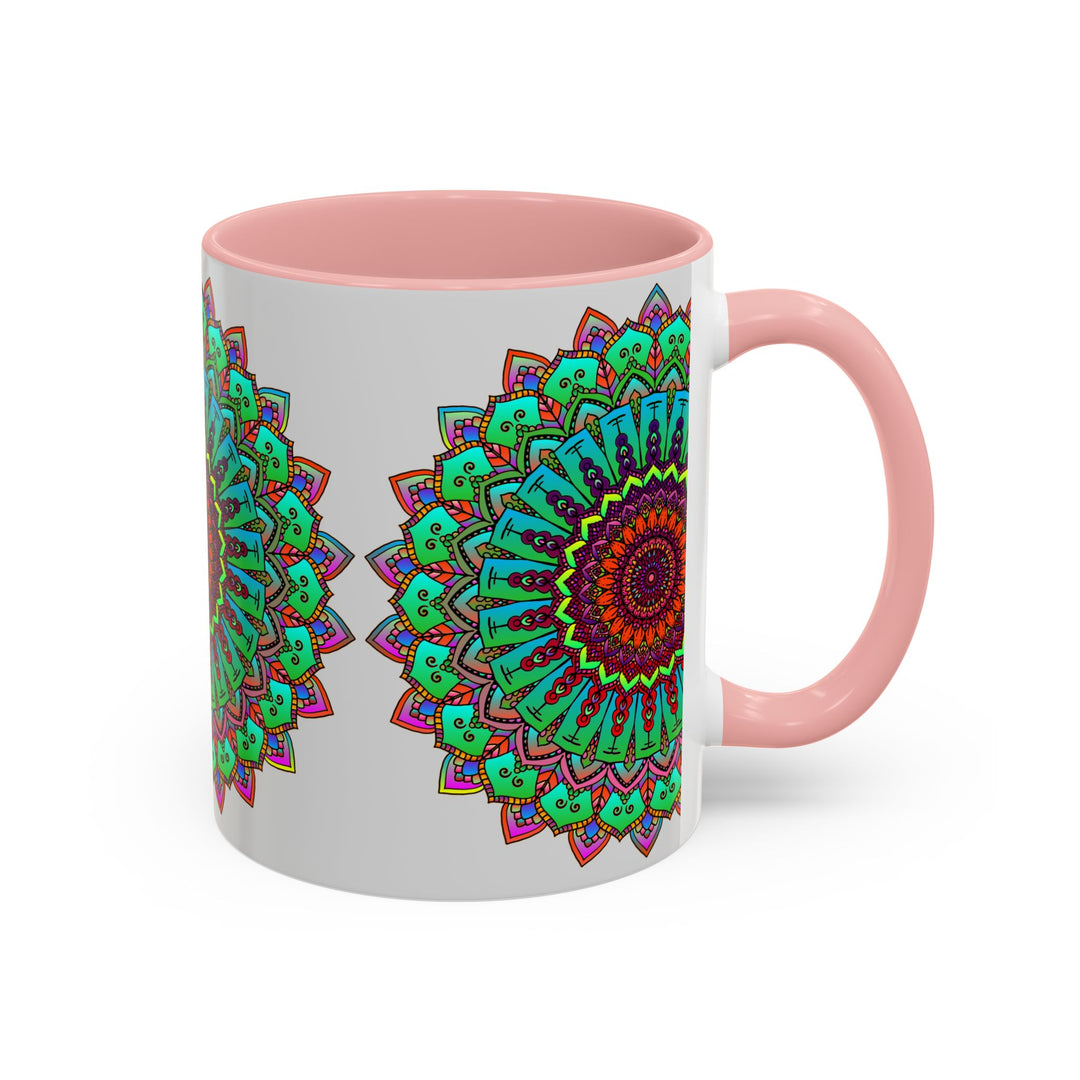 A light grey ceramic mug with a colorful mandala art design