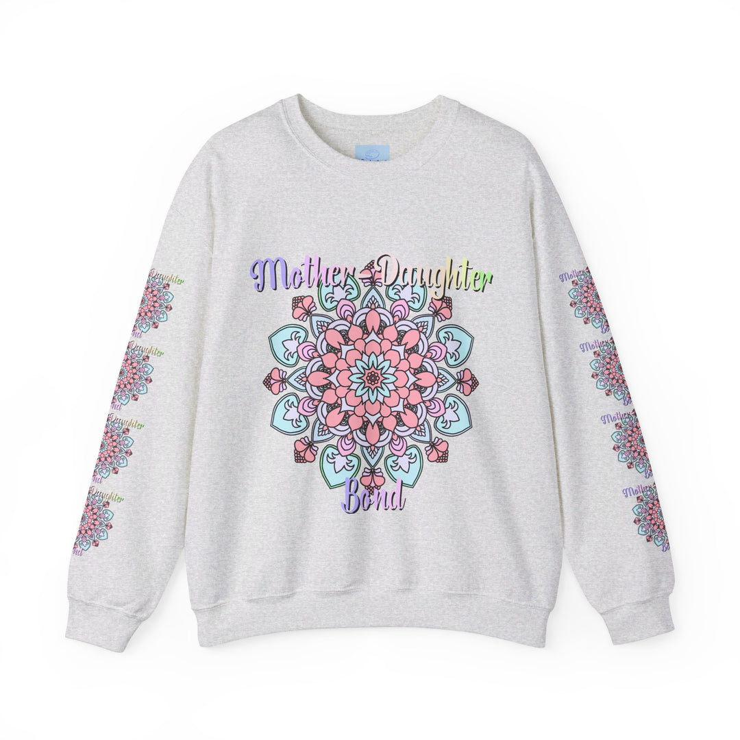 Mother and daughter holding hands and smiling, wearing matching 'Mother-Daughter Bond' Unisex Heavy Blend™ Crewneck Sweatshirts, the perfect birthday gift for mom