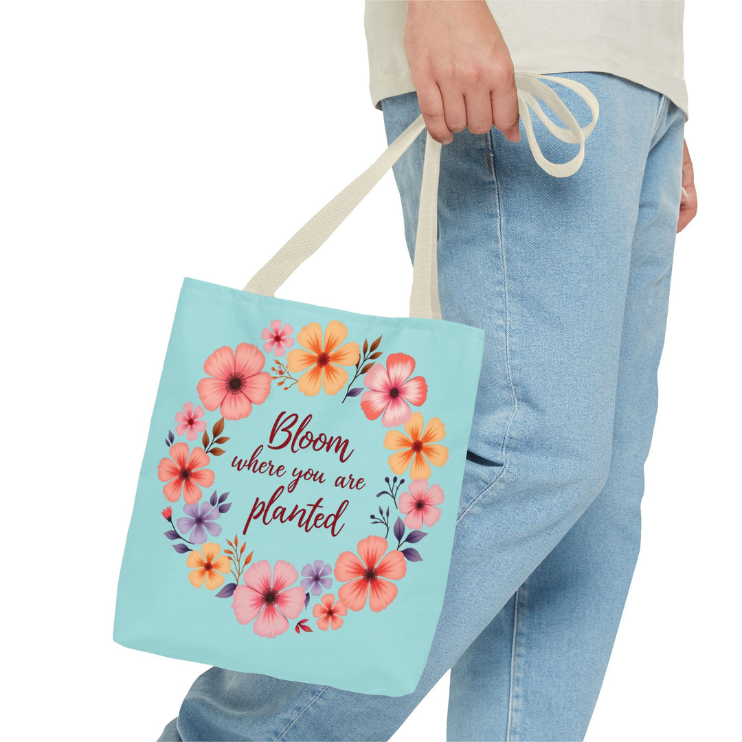 A beautiful floral tote bag in three sizes, featuring the inspiring phrase Bloom Where You Are Planted