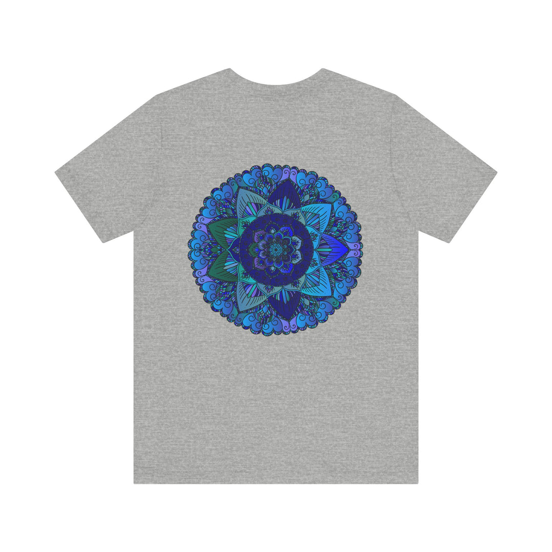 A close-up image of a blue mandala t-shirt with intricate spiritual patterns, promoting peace and harmony