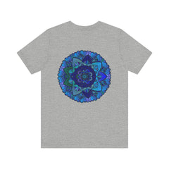A close-up image of a blue mandala t-shirt with intricate spiritual patterns, promoting peace and harmony