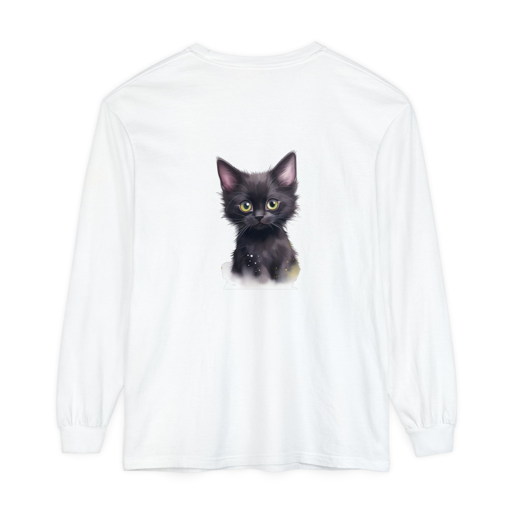 A charming black kitten with bright green eyes sitting on a soft white cotton t-shirt