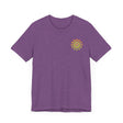 Group of friends wearing Mandala Peace & Harmony T-Shirts at a festival
