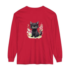 A white t-shirt with a colorful watercolor illustration of a playful kitten surrounded by floral elements