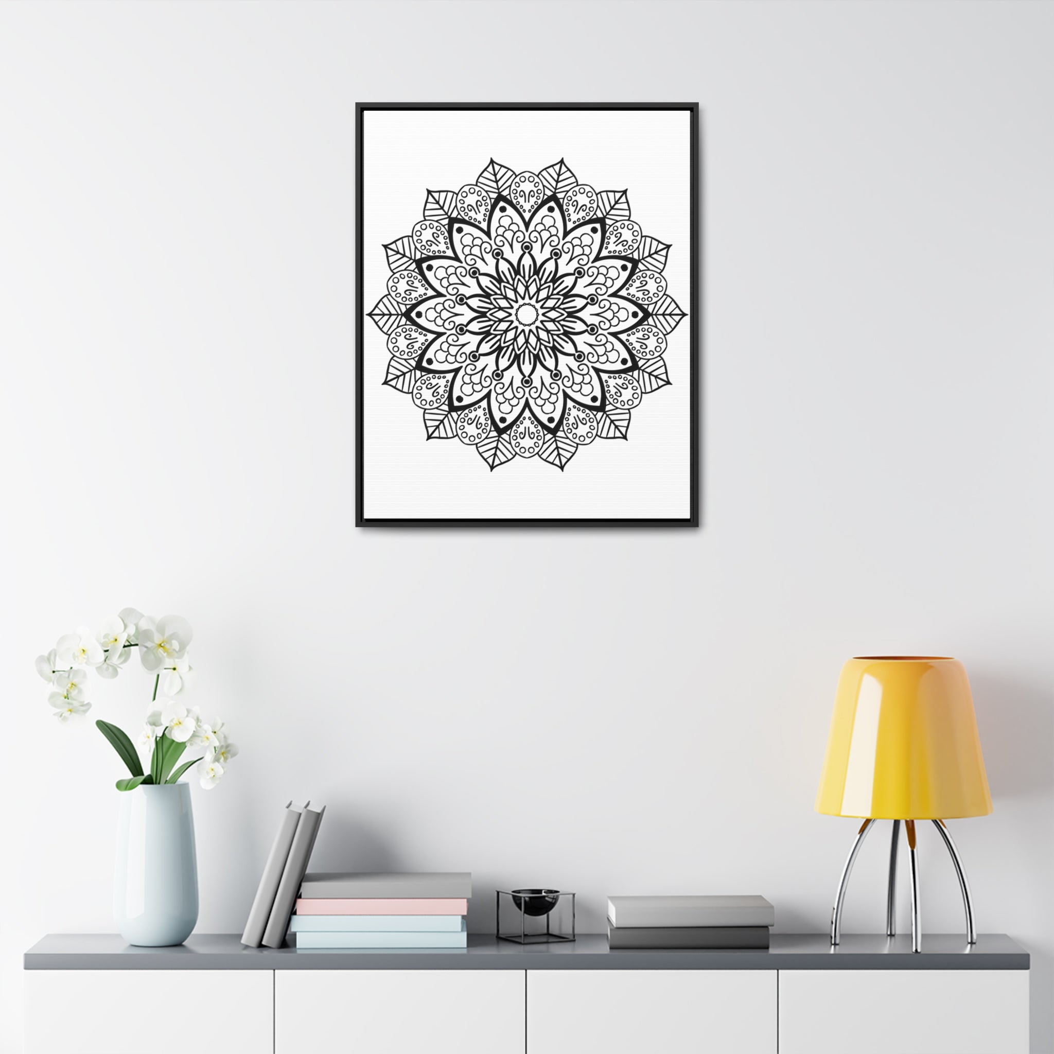 Beautiful mandala handmade art in black and white, displayed on gallery canvas wraps in a vertical frame