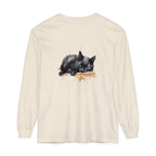 A detailed watercolor illustration of a peaceful black cat sleeping on a t-shirt