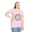 A soft, comfortable white t-shirt with a beautiful floral garland design and the text Breathe in Peace Exhale Stress in delicate cursive font