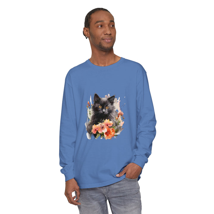 A watercolor illustration of a black cat surrounded by vibrant flowers on a t-shirt