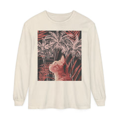 A close-up image of a soft, white T-shirt featuring a playful ginger cat lounging under a palm tree, creating a tropical and adorable design