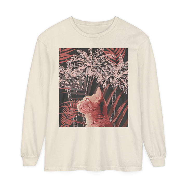 A close-up image of a soft, white T-shirt featuring a playful ginger cat lounging under a palm tree, creating a tropical and adorable design