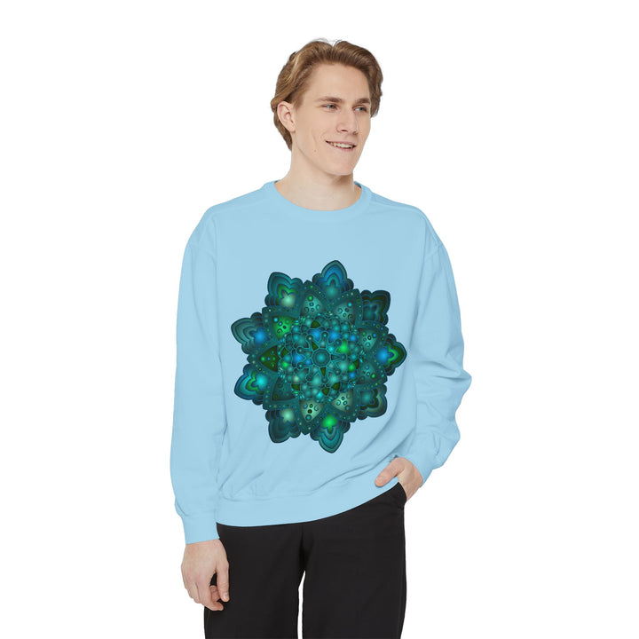 A close-up image of an intricate blue and green mandala sweatshirt design with intricate patterns and vibrant colors